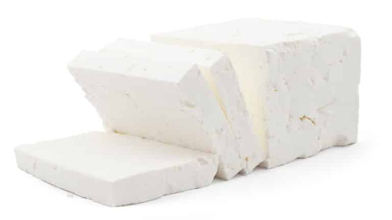 A cut mold of feta cheese